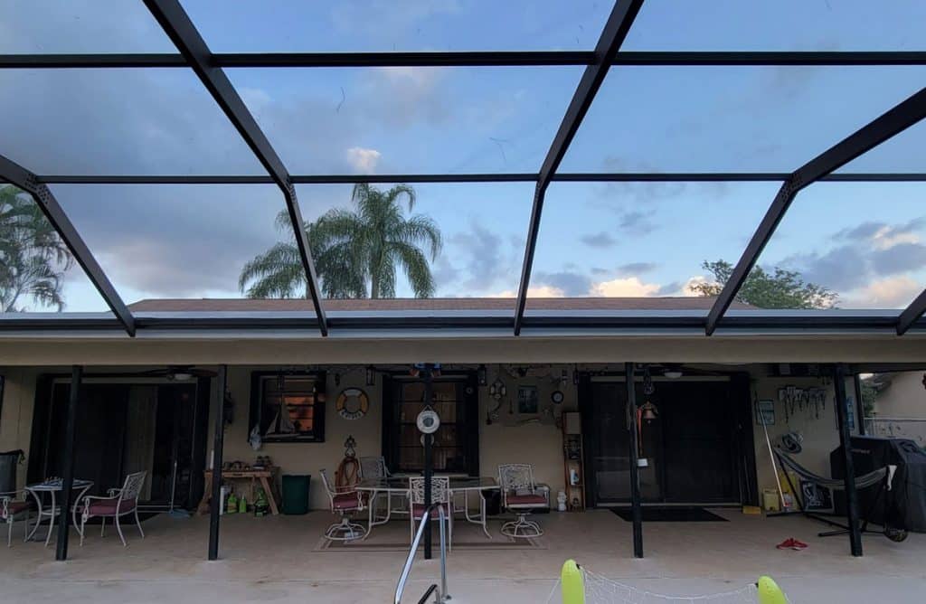 a mansard roof screen at an atlantis, fl home