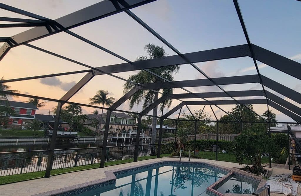 a pool enclosed by a screen in lake shores, fl