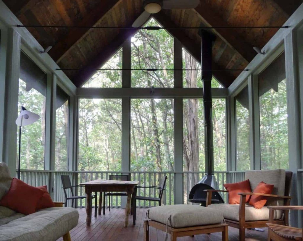 A Farmhouse Screened In Porch Idea